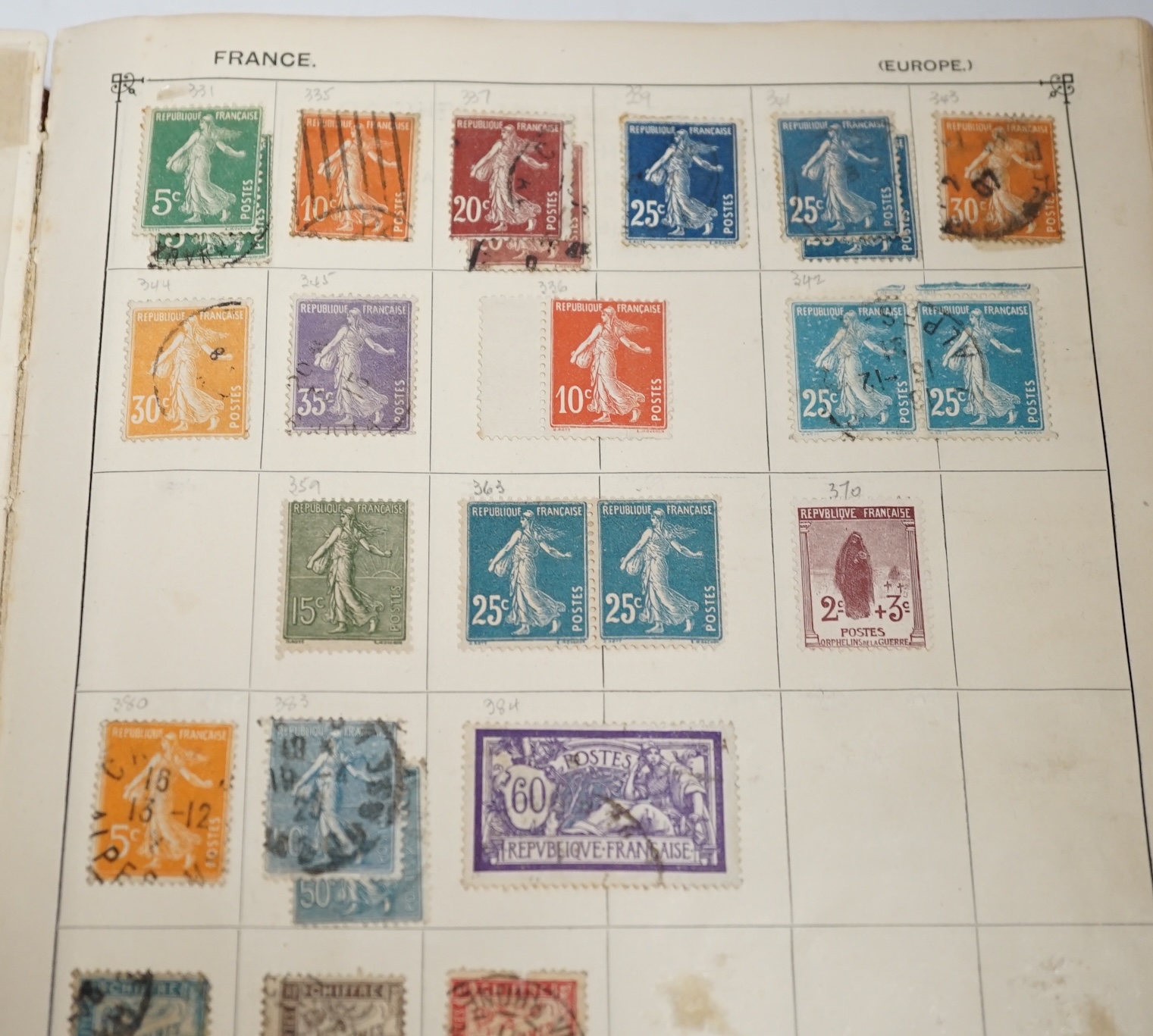 An old time collection of stamps in two albums, on leaves and loose with mint and used British Empire, USA, etc.